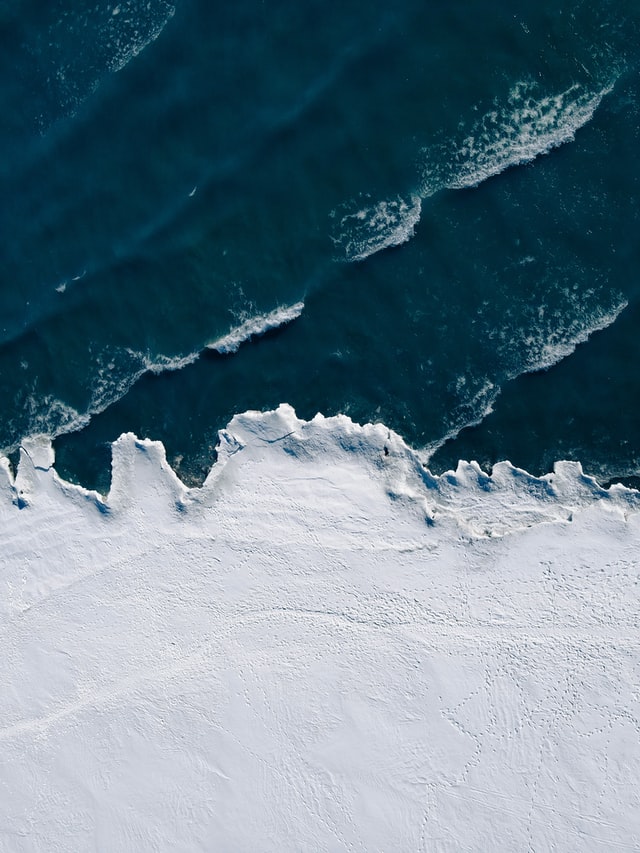 An overhead view of the ocean and its waves.