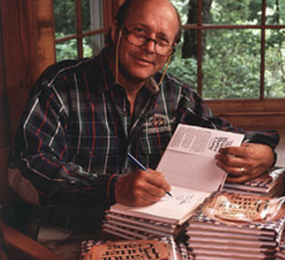 photograph of H. Jackson Brown Jr. signing books