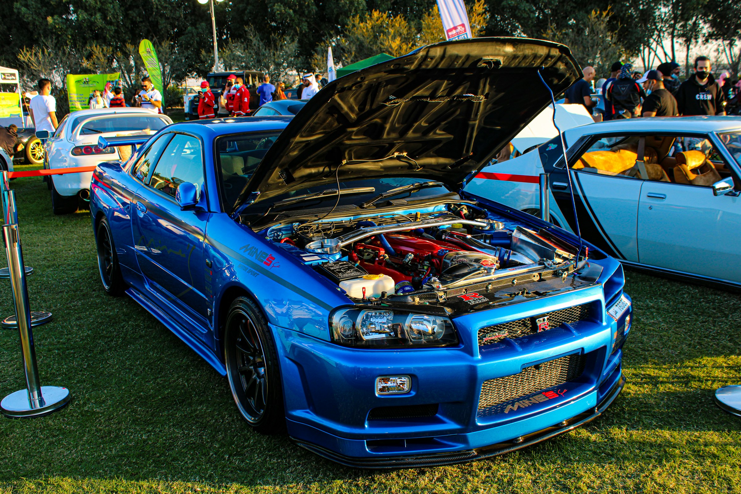 Blue Nissan GTR with hood open showing engine