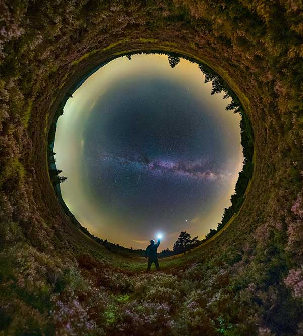 Man looking up at starry night