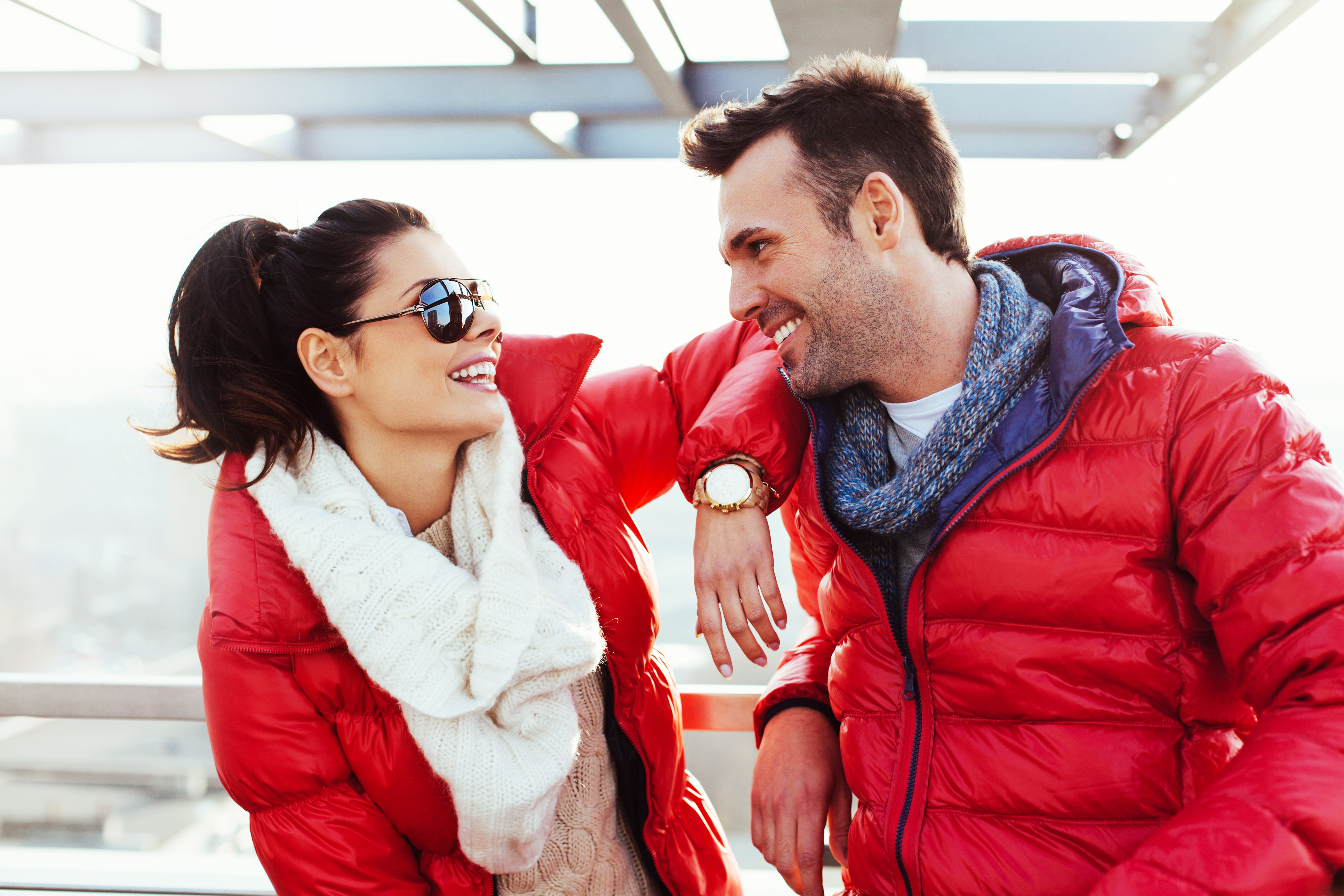 A man and woman wear down jacket.